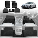 X-CAR BMW 4 Series (G26) floor mat set featuring four black carpet mats and a center rear mat, displayed with a silver BMW 4 Series Gran Coupe. The image also shows the X-CAR floor mats installed in the front and rear footwells of the vehicle interior.