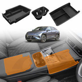 An image showing the black X-CAR center console organizer tray, armrest storage box, and the orange cup holder insert for the BYD SEALION 7 2025-Onwards, displayed within the vehicle's interior.