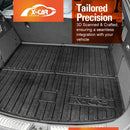 Car trunk with a black X-CAR floor mat and X-Car branding.