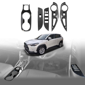 Trim panels for Toyota Corolla Cross 2022-2025 model years, displayed in black with a carbon fiber print, shown in isolation and installed on a vehicle interior.