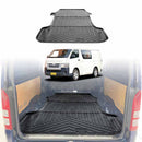 A black rubber cargo mat for a Toyota HiAce van, displayed in the cargo area of the van.