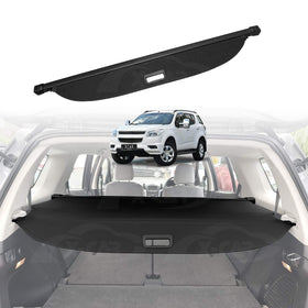 Car trunk security/Cargo cover shield with a white Holden Colorado7 SUV in the background