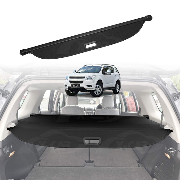 Car trunk security/Cargo cover shield with a white Holden Colorado7 SUV in the background