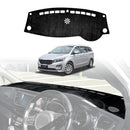 Kia Carnival 2015–2020 black dashboard dash mat installed, custom-fit non-slip dash cover protecting interior from UV damage and reducing windshield glare.