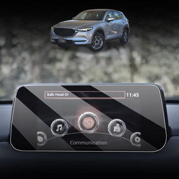 **Alt text：**
X-CAR tempered glass screen protector installed on Mazda CX-5 touchscreen display with SUV vehicle in background, anti-scratch dashboard protection accessory.