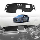 Car dashboard cover with a Mazda cx9 in the background