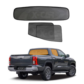 X-CAR car rear window and rear windscreen sunshades for Mitsubishi Triton MQ MR 2015-2024 installed on the windows of a Triton.