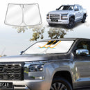 X-CAR Windscreen sun shade for Mitsubishi Triton MV Double Cab, installed on the windscreen of a Triton MV.