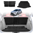 Custom fit black boot liner and back seat protector for a Toyota Corolla Hatchback, displayed in the cargo area of the car.