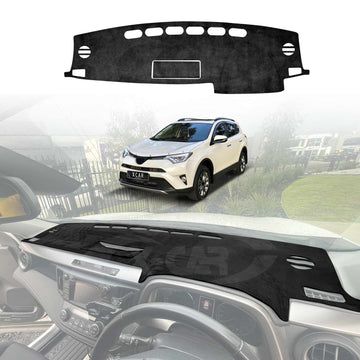 Black dashboard cover mat for Toyota RAV4 2013–2018 displayed above and installed on the dashboard interior, with a white SUV shown in the background.