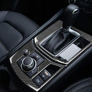 Carbon fibre style gear box frame for Mazda CX5 CX-5 2017-2025, installed inside a vehicle, showcasing the gear shift panel and media panel with a black color scheme.