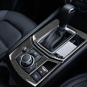 Carbon fibre style gear box frame for Mazda CX5 CX-5 2017-2025, installed inside a vehicle, showcasing the gear shift panel and media panel with a black color scheme.
