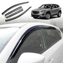 A set of black car weather shields installed on the side windows of a Mazda CX-5.