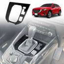 A black gear box shifter frame for a Mazda CX-9, displayed in the context of a car interior.