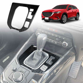 A black gear box shifter frame for a Mazda CX-9, displayed in the context of a car interior.